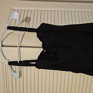 Medium, lace up back black dress